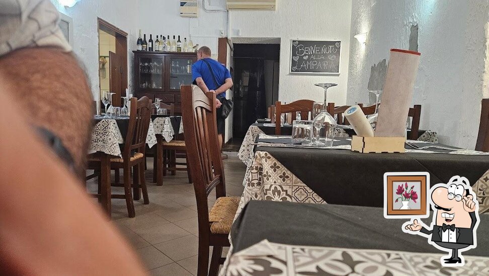 Siediti a un tavolo di La Lampara bar pizzeria osteria.