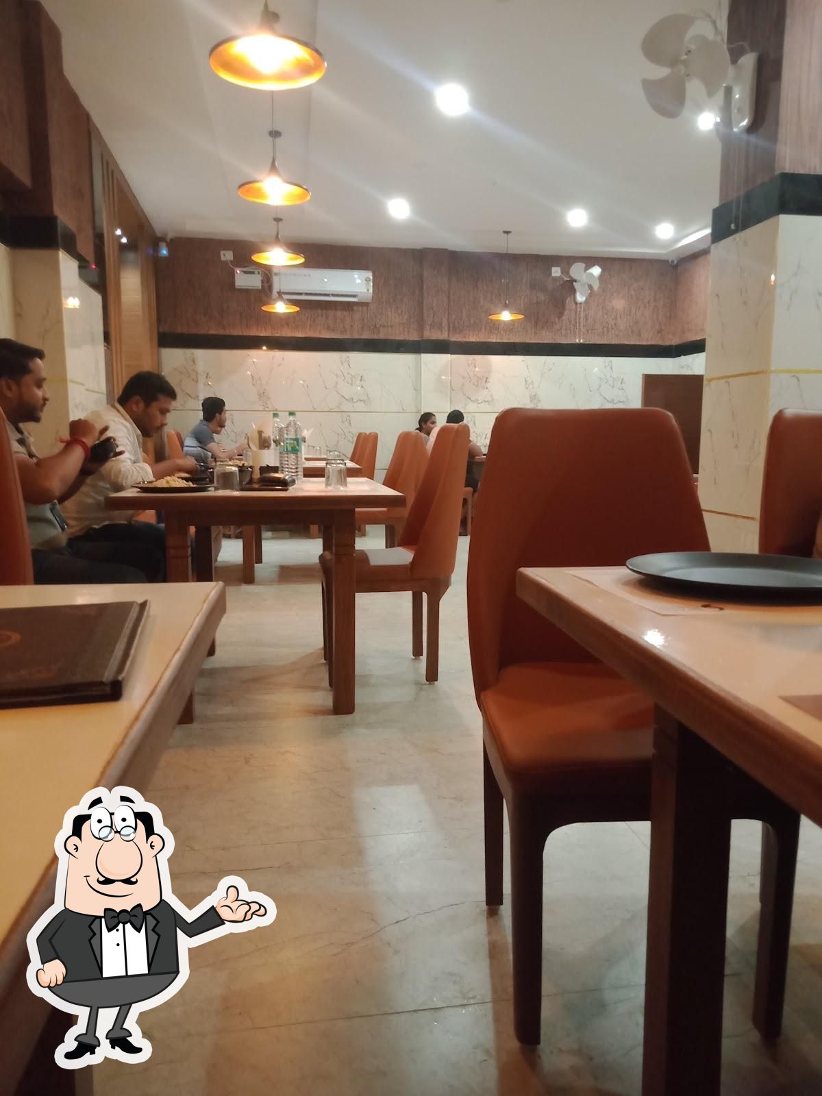 Take a seat at one of the tables at SPARK RESTRO.