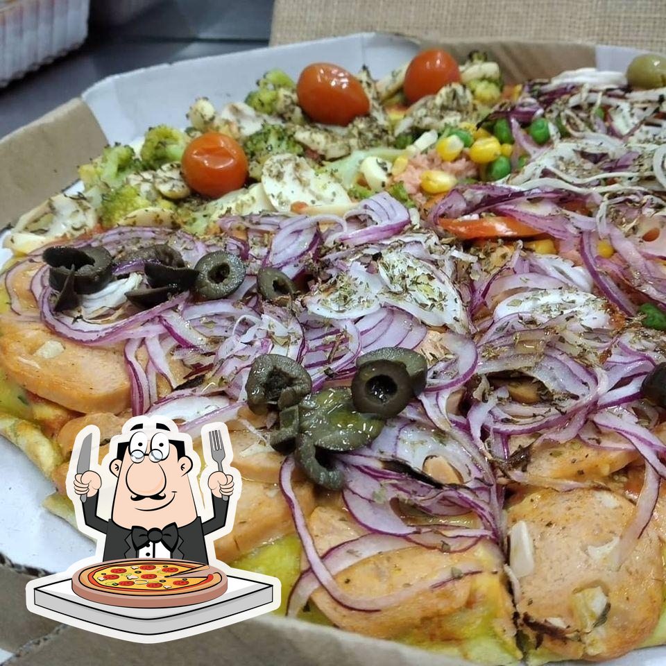 Experimente pizza no Na Chácara Pizzaria.