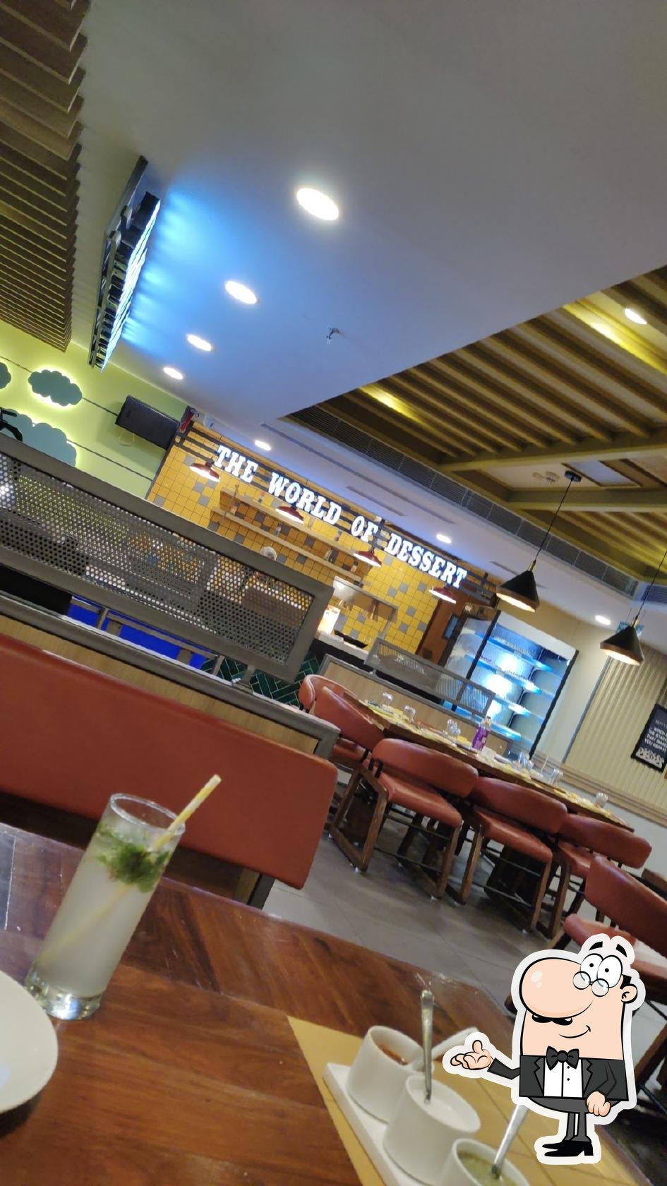 Take a seat at one of the tables at AB's - Absolute Barbecues Navallur, Chennai.