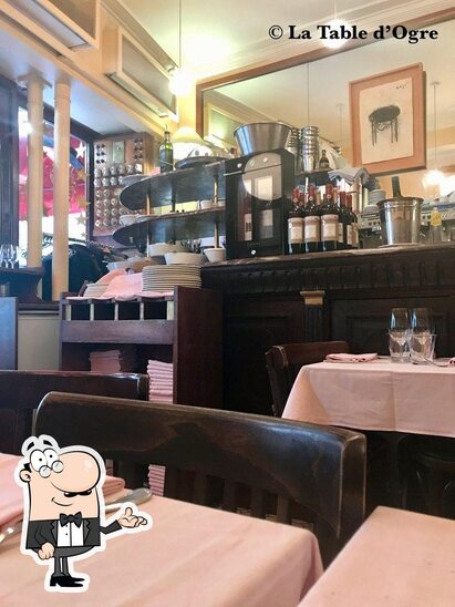 Take a seat at one of the tables at Restaurant Le Cherche Midi.