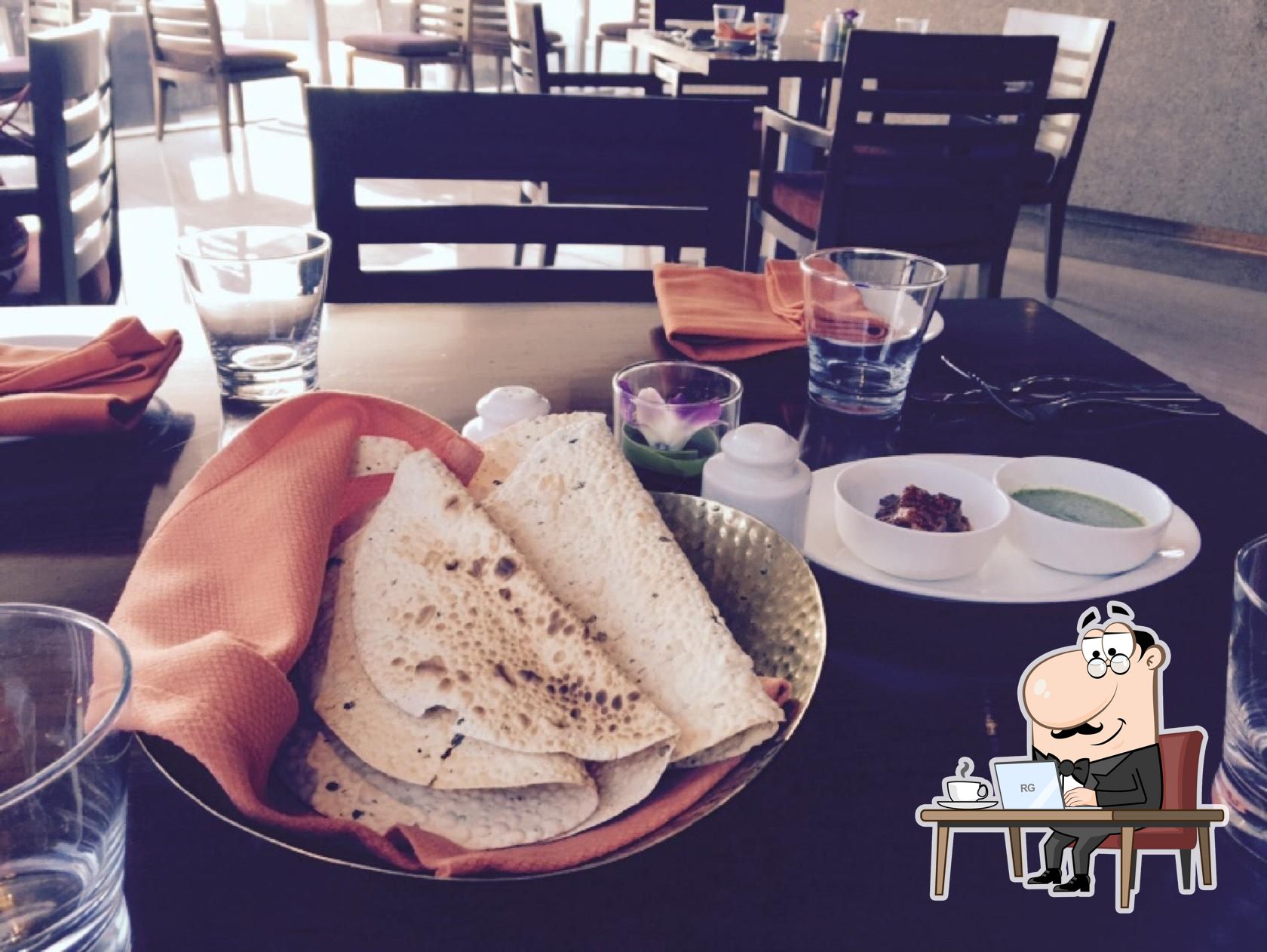 Take a seat at one of the tables at Spice Haat.