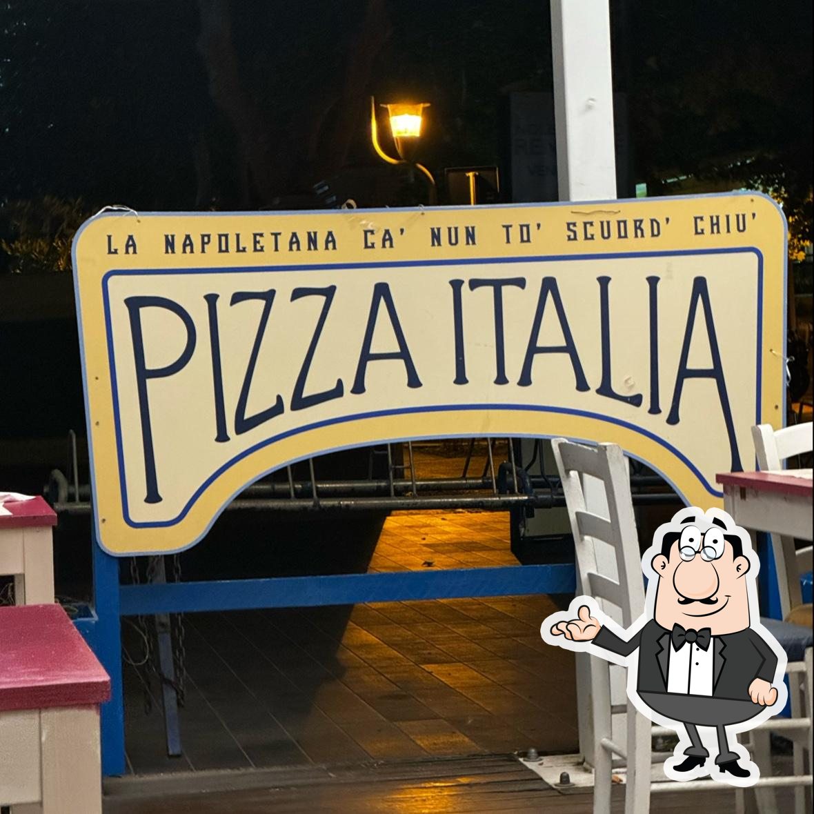 Siediti a un tavolo di Pizza Italia.