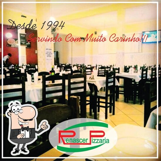 O interior do Pizzaria Renascer.