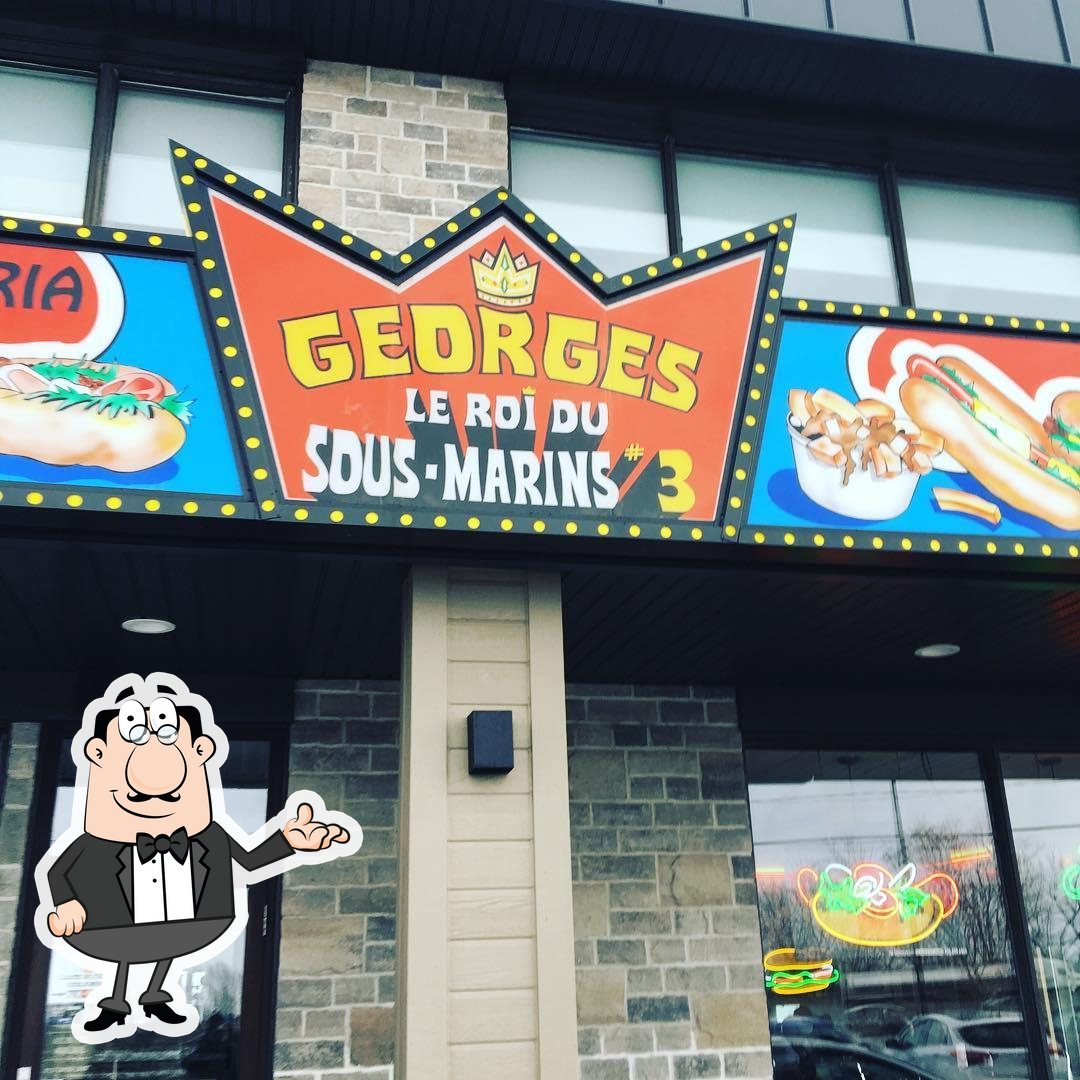Take a seat at one of the tables at PIZZERIA GEORGES LE ROI DU SOUS-MARIN.