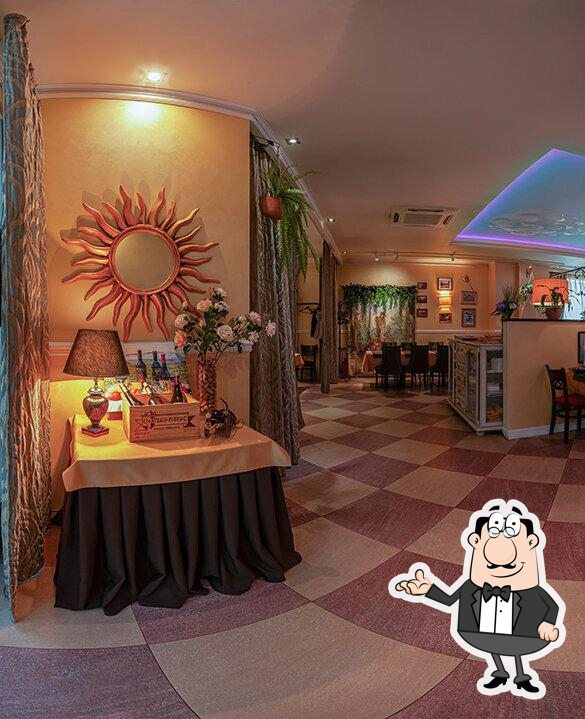 Take a seat at one of the tables at Restaurant di Paolo.