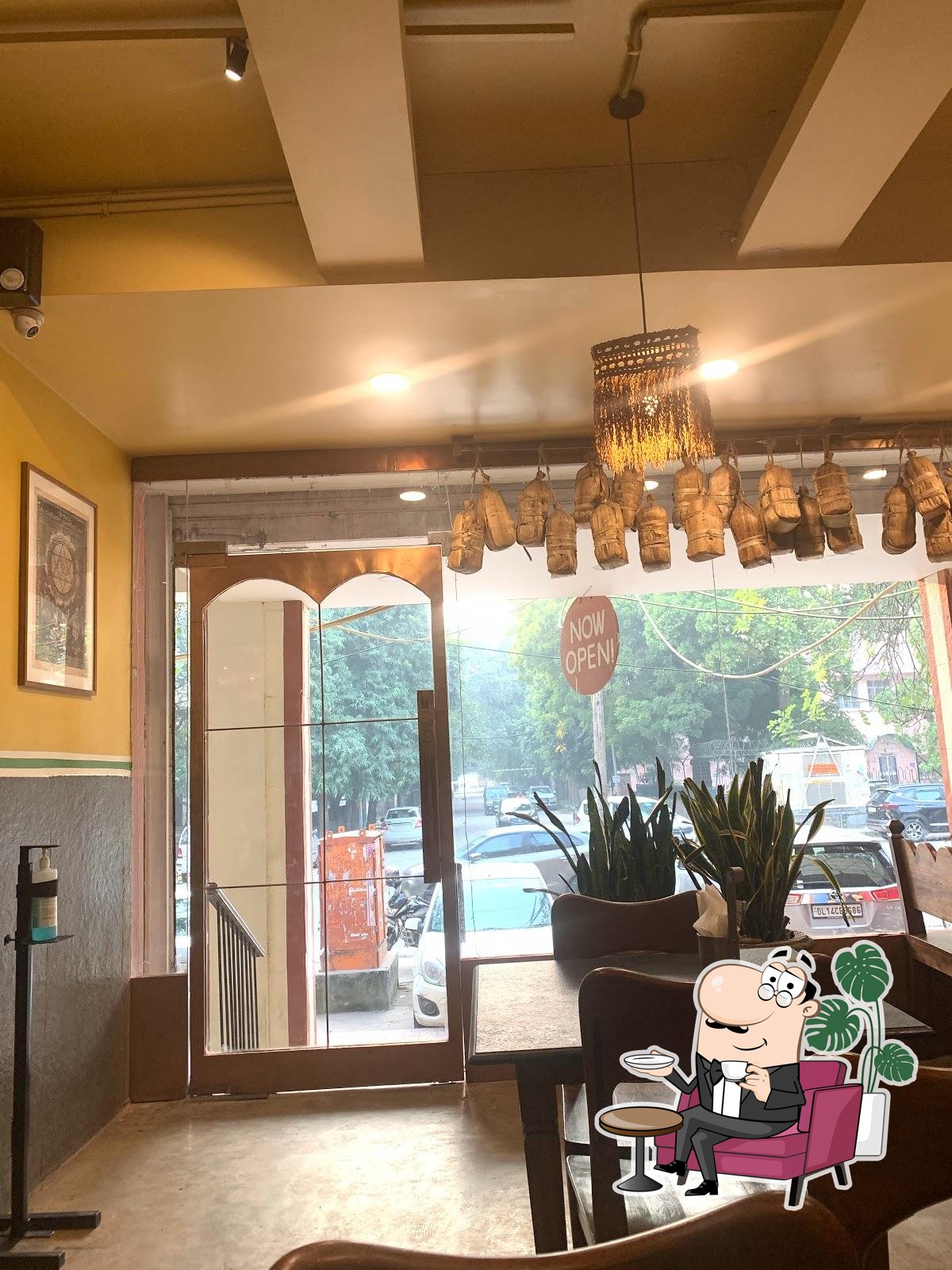 Take a seat at one of the tables at Carnatic Cafe.