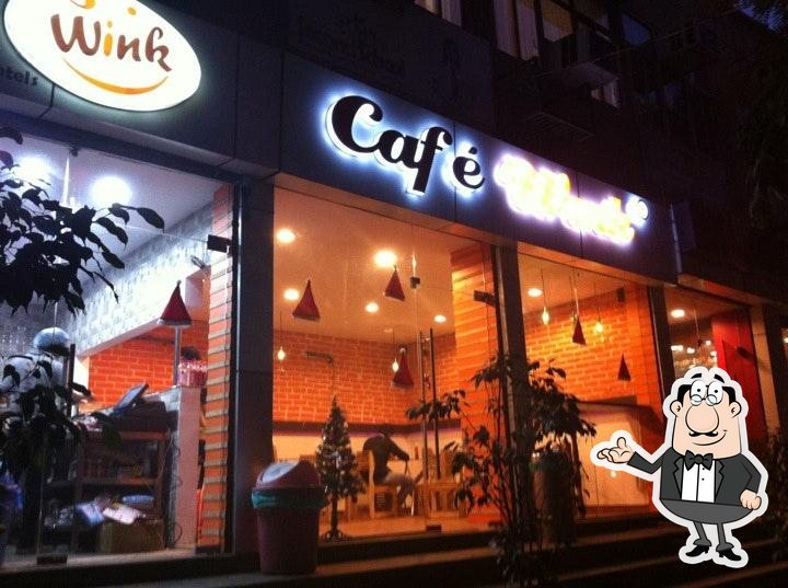 Take a seat at one of the tables at Cafe Wink.
