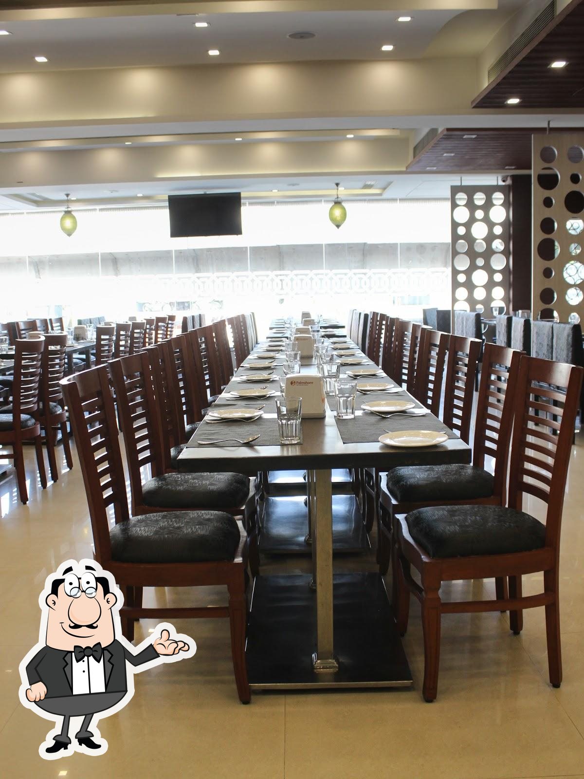 The interior of Palmshore Restaurant Ashok Nagar.