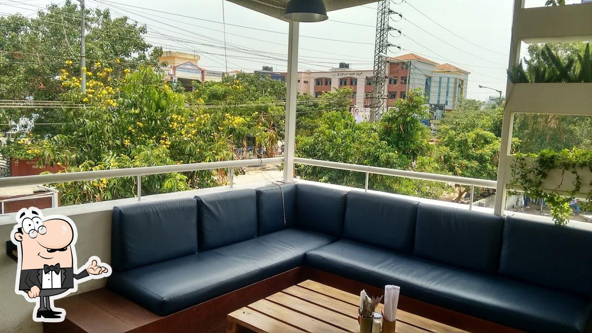 Take a seat at one of the tables at Cafe Here & Now.