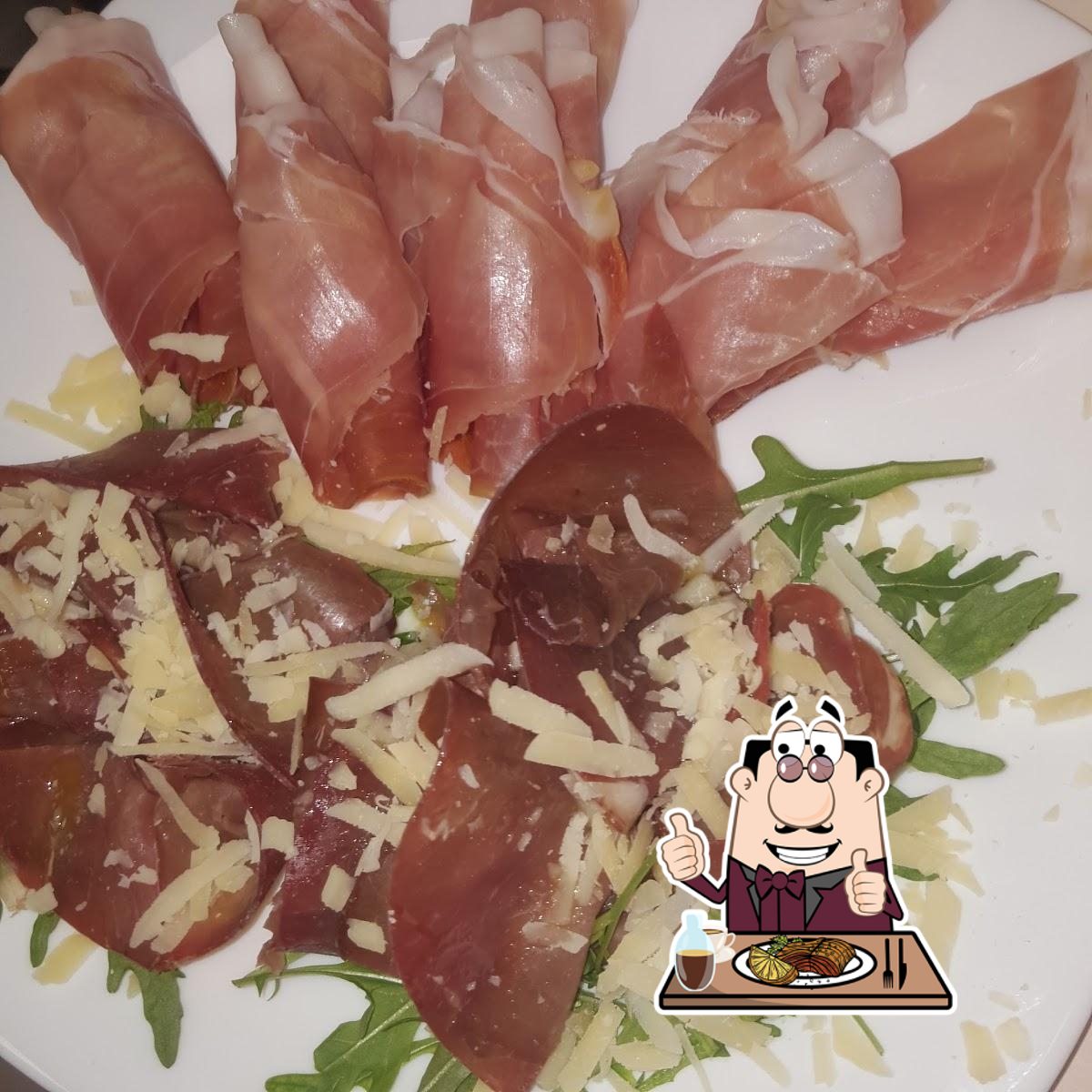 Prova i piatti di carne a Pizzeria Exclusive.