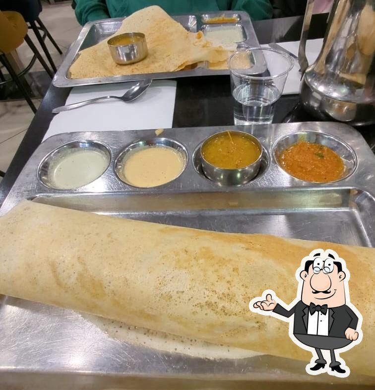 Installez-vous à l'une des tables de Arya Bhavan Paris, France.