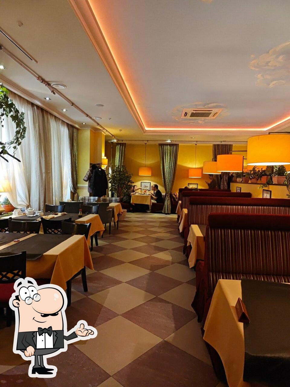 Take a seat at one of the tables at Restaurant di Paolo.