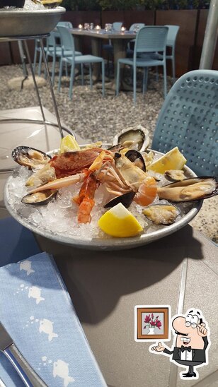 Siediti a un tavolo di Fresco Ristorante.