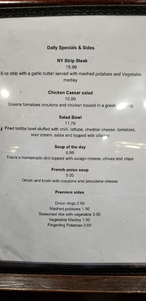 A detailed view of Brass Rail Bar and Grill's menu, highlighting the variety and complexity of the dishes offered