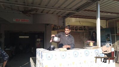 Take a seat at one of the tables at GOLDEN ZOYA CAFE