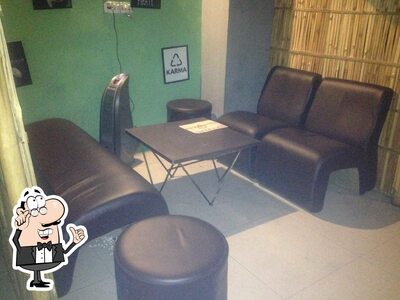 Take a seat at one of the tables at Hut K