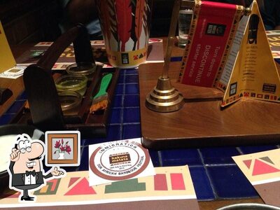Take a seat at one of the tables at Barbeque Nation