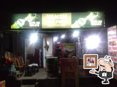Take a seat at one of the tables at Famous Vansh Fast Food