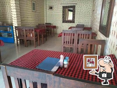 Take a seat at one of the tables at Aanchal Restaurant