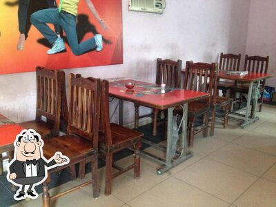 Take a seat at one of the tables at Platinum Restro-Bar
