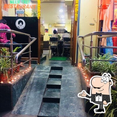 Check out how Neem Tree Restaurant Puttaparthi looks inside