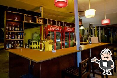 Take a seat at one of the tables at Cuba Beach Shack