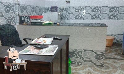 Take a seat at one of the tables at S.R Chicken Center