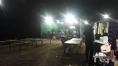 Take a seat at one of the tables at श्री गजराज ढाबा