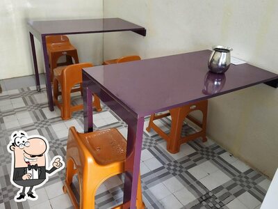 Take a seat at one of the tables at Hotel Ganta