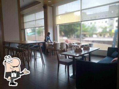 Check out how Express Café - Holiday Inn Express looks inside