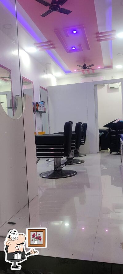 Take a seat at one of the tables at AL- Madina Biryani Center