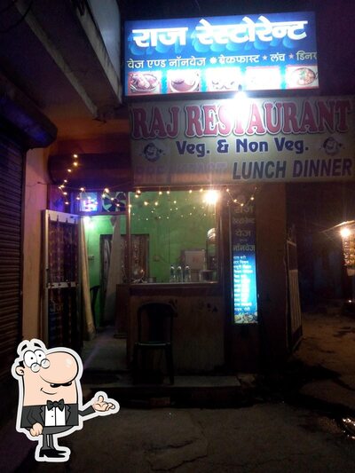 Take a seat at one of the tables at Raj Restaurant