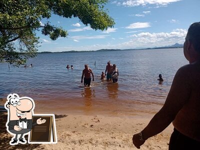 Você pode espairecer no na área externa do Toca do Tatu Bar e Restaurante
