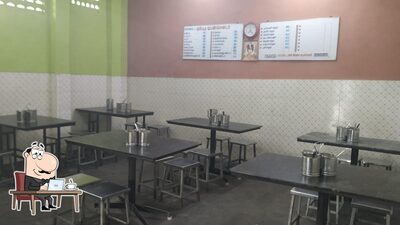 Take a seat at one of the tables at Thambudu Mess