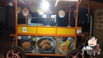 Take a seat at one of the tables at THE UNIQUE FAST FOOD