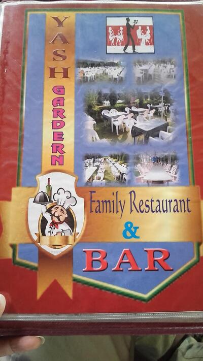 The advertisement shows information about Yash Garden Family Restaurant & Bar