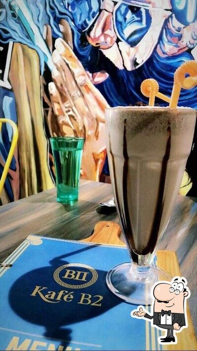 Take a seat at one of the tables at Kafé B II