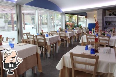 Siediti a un tavolo di Langusta Ristorante Pizzeria