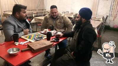 Take a seat at one of the tables at Singh Brofie cafe