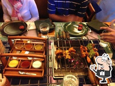 Take a seat at one of the tables at Barbeque Nation