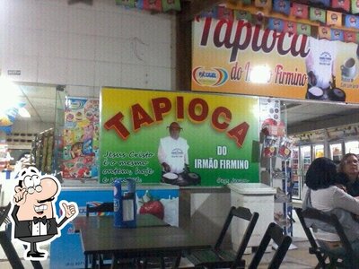Sente em uma das mesas no Tapioca Do Irmao Firmino