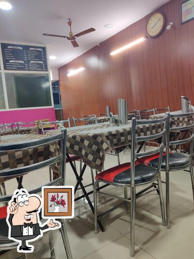Take a seat at one of the tables at KING SAOUD RESTAURANT