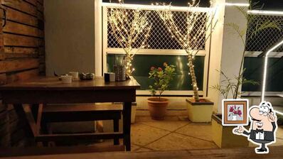 Take a seat at one of the tables at Elixir Resto Pub