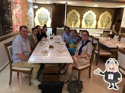 Take a seat at one of the tables at Manika Restaurants
