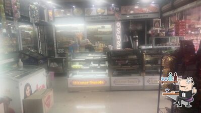Take a seat at one of the tables at न्यू मां भगवता