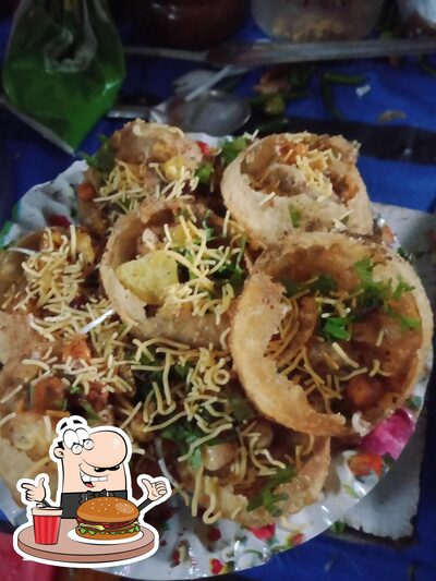 Taste one of the burgers served at Ganesh Tiffin Center