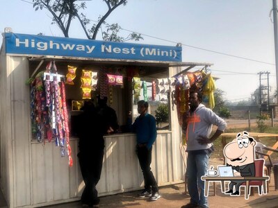 Take a seat at one of the tables at Highway Nest