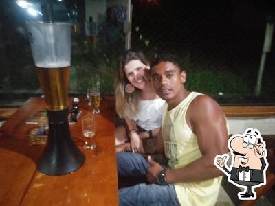 Sente em uma das mesas no Restaurante Carro de Boi