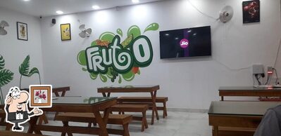 Take a seat at one of the tables at FRUTO resto cafe